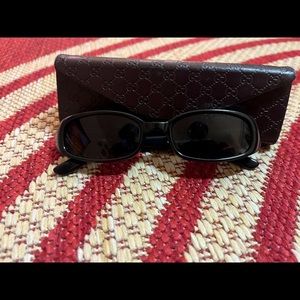 Gucci sunglasses with fully collapsible case.